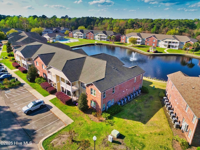 aerial perspective of suburban area featuring a large body of water