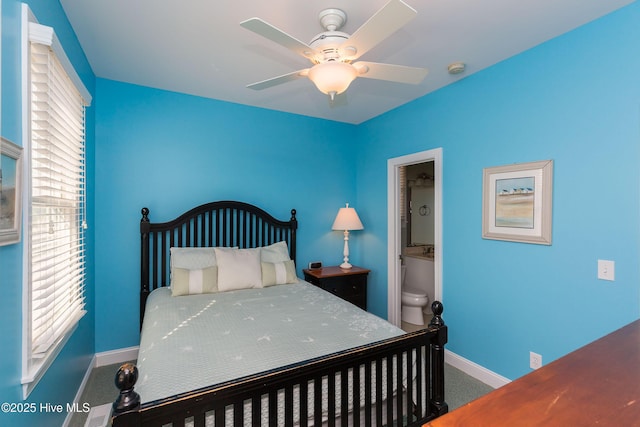 2216 S Shore Dr Unit A & B, Surf City, NC 28445 - carpeted bedroom featuring baseboards, ceiling fan, and ensuite bathroom