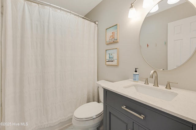 bathroom featuring toilet and vanity