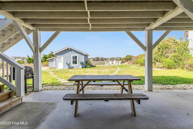 view of patio / terrace with an outbuilding