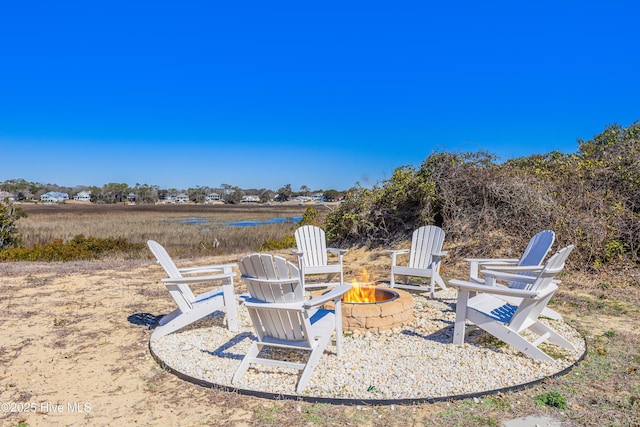 view of yard featuring a patio and an outdoor fire pit