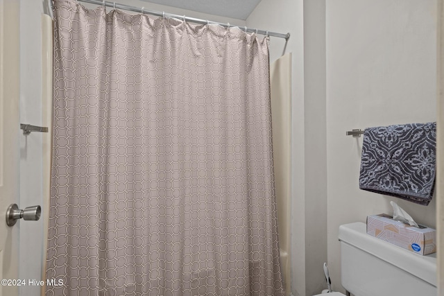 bathroom featuring toilet