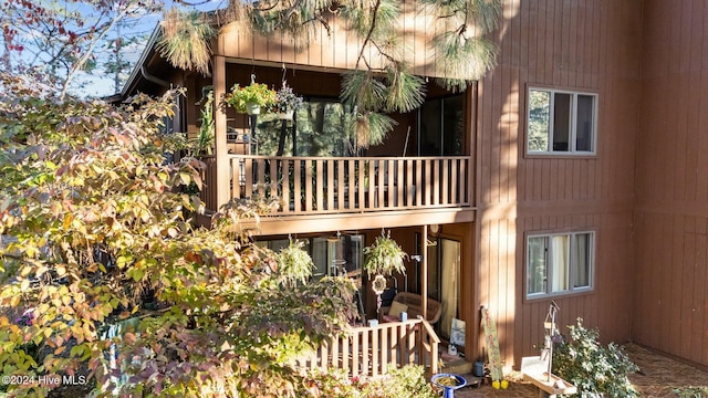 view of side of property with a balcony