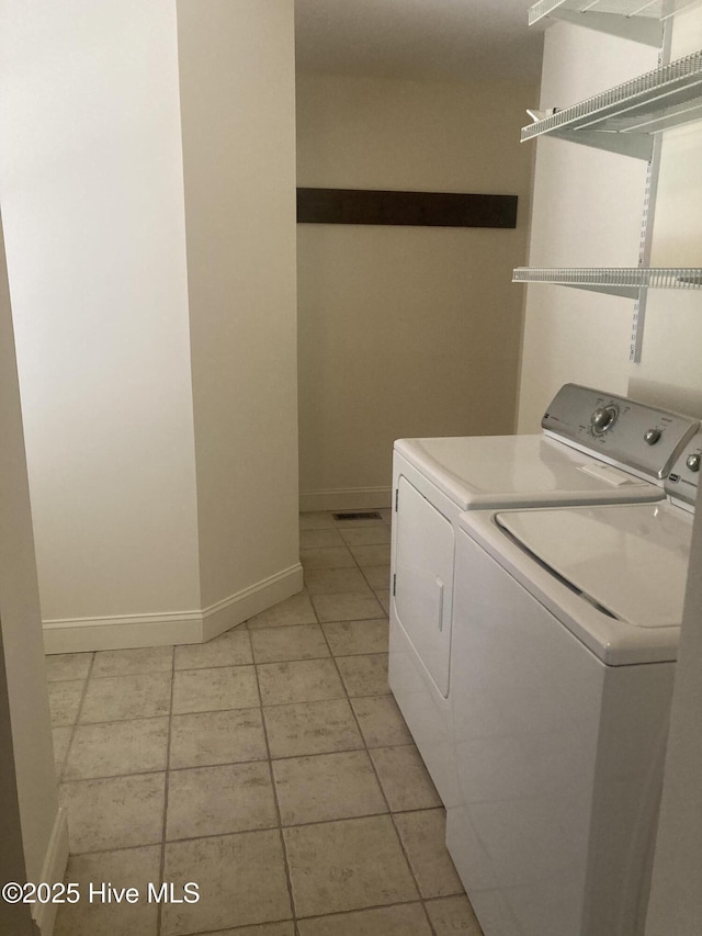 empty room featuring ceiling fan, baseboards, and wood finished floors