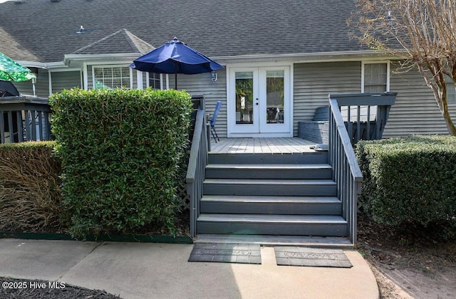1714 Pine St, Elizabeth City, NC 27909 - view of exterior entry featuring french doors, roof with shingles, and a deck