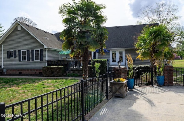 1714 Pine St, Elizabeth City, NC 27909 - view of front of house with a front yard, crawl space, a fenced front yard, and roof with shingles
