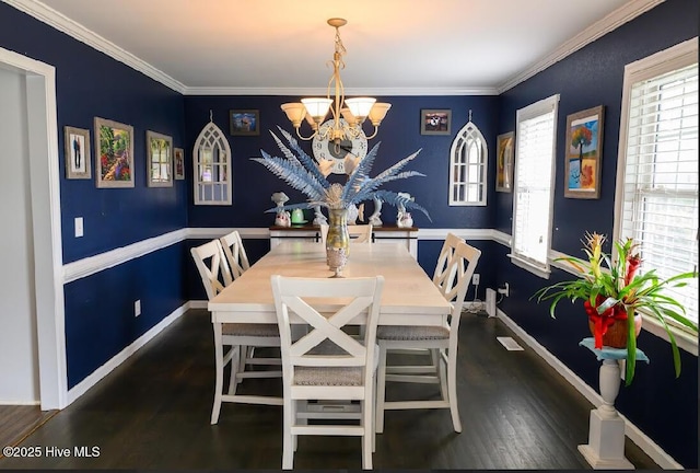 1714 Pine St, Elizabeth City, NC 27909 - dining area featuring ornamental molding, dark wood-type flooring, and a chandelier