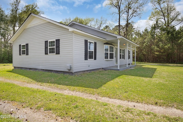 view of home's exterior featuring a yard