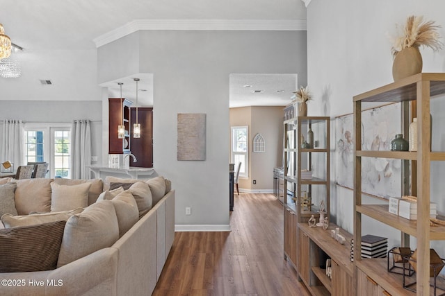 1096 Rutledge Ct NW, Calabash, NC 28467 - living area featuring wood finished floors, baseboards, and crown molding