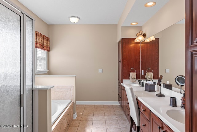 1096 Rutledge Ct NW, Calabash, NC 28467 - full bath featuring double vanity, a garden tub, a shower with door, recessed lighting, and baseboards