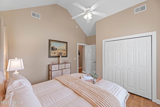 1096 Rutledge Ct NW, Calabash, NC 28467 - bedroom featuring high vaulted ceiling, light wood-type flooring, a closet, and ceiling fan