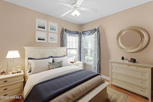 1096 Rutledge Ct NW, Calabash, NC 28467 - bedroom featuring light wood-style floors, a ceiling fan, and baseboards