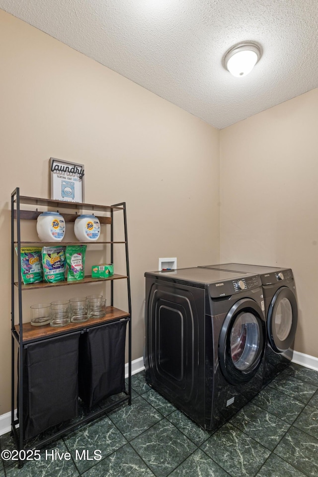 1096 Rutledge Ct NW, Calabash, NC 28467 - laundry area featuring separate washer and dryer, baseboards, and a textured ceiling