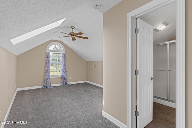 1096 Rutledge Ct NW, Calabash, NC 28467 - additional living space with a skylight, lofted ceiling, baseboards, carpet, and ceiling fan