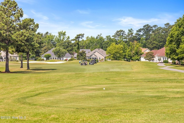 1096 Rutledge Ct NW, Calabash, NC 28467 - view of property's community with a residential view, a lawn, and golf course view