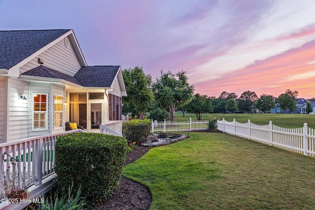 1096 Rutledge Ct NW, Calabash, NC 28467 - yard at dusk featuring a sunroom