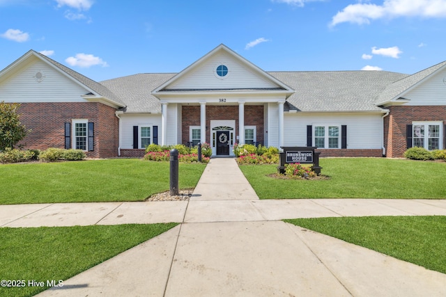 1096 Rutledge Ct NW, Calabash, NC 28467 - view of front facade with brick siding and a front lawn