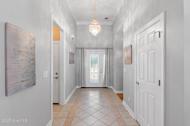 1096 Rutledge Ct NW, Calabash, NC 28467 - foyer entrance featuring inlaid floor details, a chandelier, baseboards, light tile patterned flooring, and crown molding