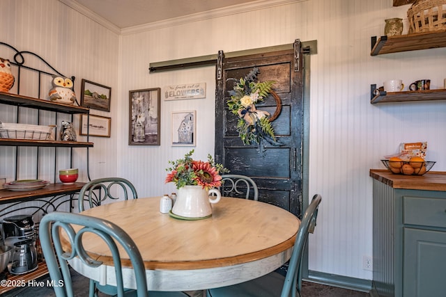 dining space with crown molding