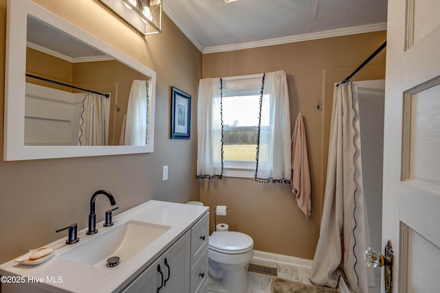 bathroom featuring crown molding, toilet, vanity, baseboards, and visible vents