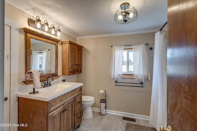 bathroom featuring baseboards, ornamental molding, visible vents, and vanity