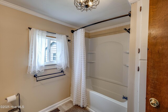 bathroom featuring crown molding, baseboards, and shower / tub combo with curtain
