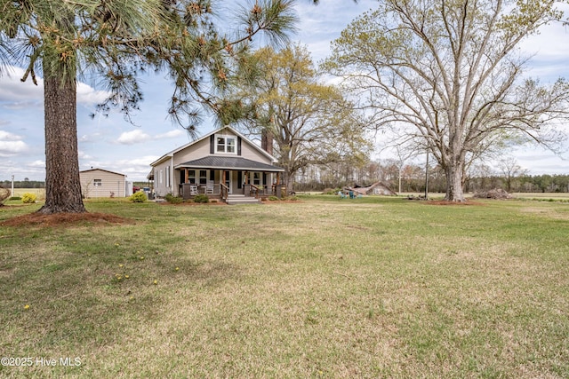view of yard with covered porch