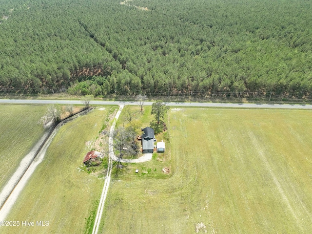 birds eye view of property with a rural view and a view of trees