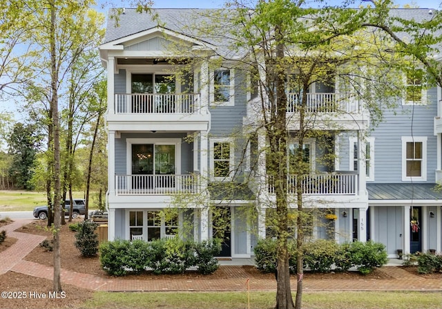 view of front of home with a balcony and board and batten siding