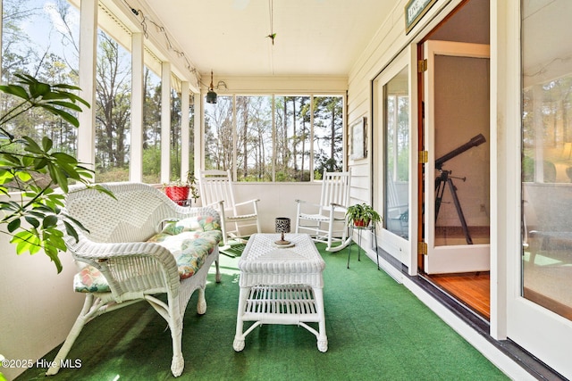 sunroom / solarium featuring a healthy amount of sunlight