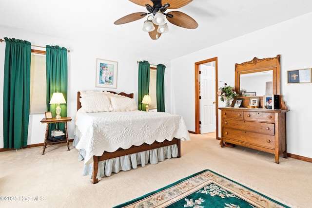 bedroom with ceiling fan, baseboards, and carpet floors