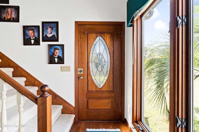 entryway featuring stairs and wood finished floors