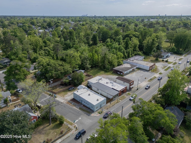 bird's eye view featuring a wooded view