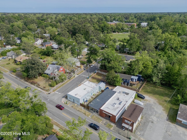 birds eye view of property with a wooded view