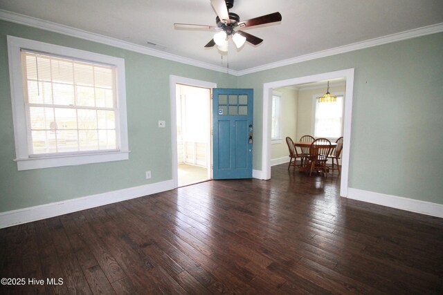 entrance foyer with ornamental molding, visible vents, a ceiling fan, and hardwood / wood-style flooring