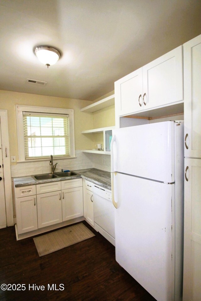 kitchen with white cabinetry, open shelves, white appliances, a sink, and visible vents
