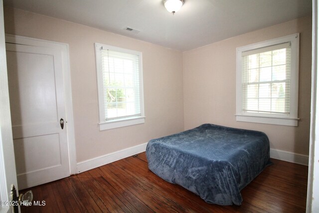 bedroom featuring baseboards, visible vents, billiards, and wood-type flooring