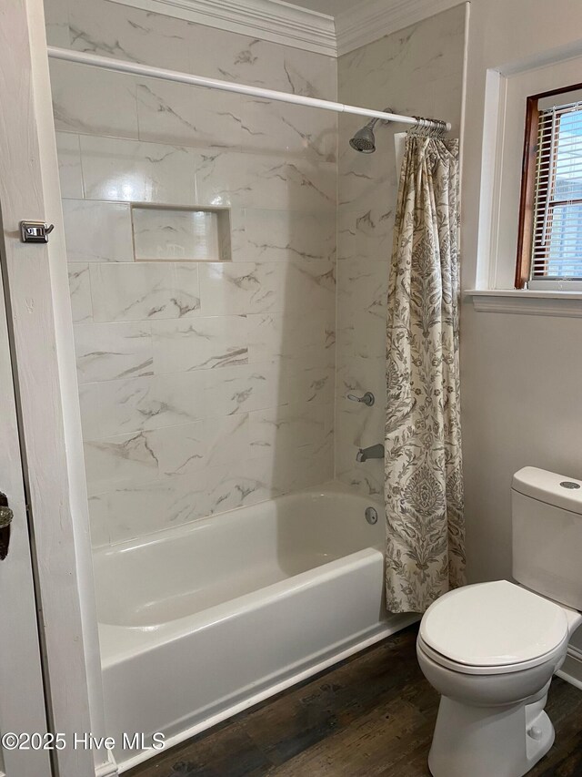 bathroom featuring shower / bath combo, wood finished floors, toilet, and crown molding