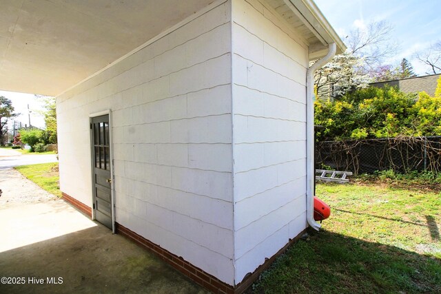 exterior space featuring fence and a yard