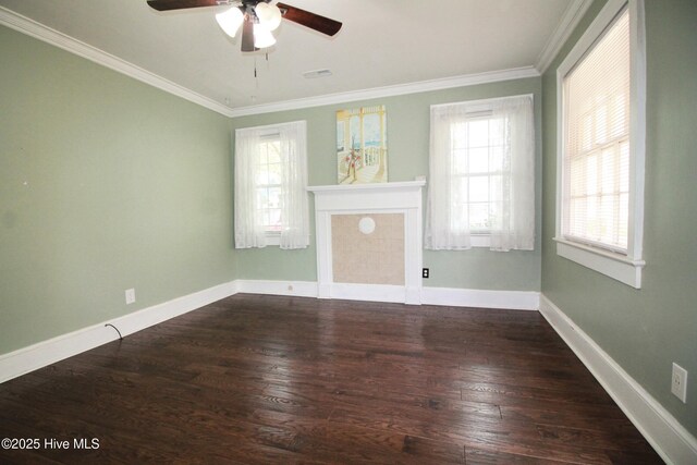 unfurnished living room with crown molding, baseboards, visible vents, a ceiling fan, and wood finished floors