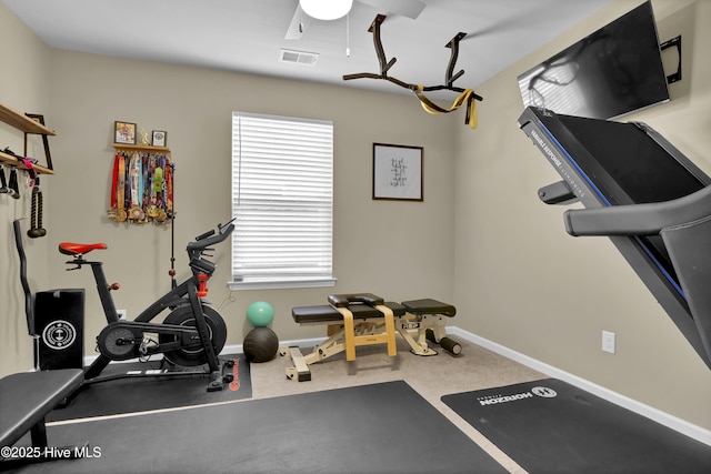 exercise area featuring carpet flooring, baseboards, and visible vents