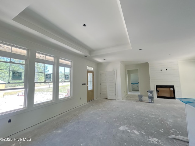 45 Mill Creek Dr, Minnesott Beach, NC 28510 - unfurnished living room featuring a large fireplace, a raised ceiling, and ornamental molding