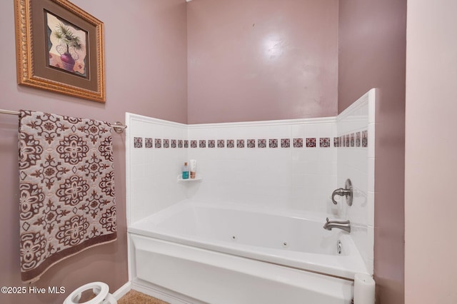 bathroom featuring a tub with jets