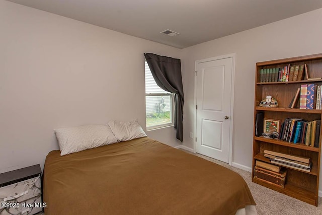 bedroom with visible vents, baseboards, and carpet flooring