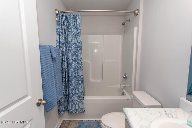 full bathroom featuring shower / bathtub combination with curtain, vanity, and toilet