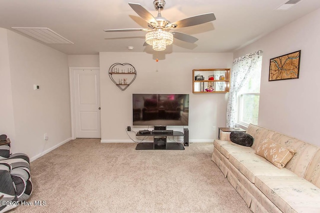 carpeted living room featuring visible vents, baseboards, and a ceiling fan