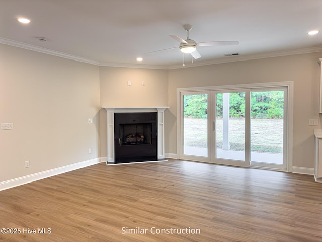 179 N Brightleaf Dr, Minnesott Beach, NC 28510 - unfurnished living room with light wood finished floors, crown molding, ceiling fan, recessed lighting, and baseboards