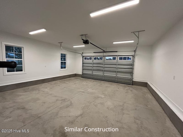 179 N Brightleaf Dr, Minnesott Beach, NC 28510 - garage featuring baseboards and a garage door opener