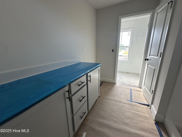 610 Poppleton Dr, Hampstead, NC 28443 - bathroom with baseboards, vanity, and wood finished floors