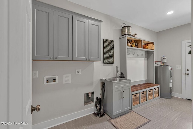 1560 White Oak River Rd, Maysville, NC 28555 - washroom with hookup for an electric dryer, electric water heater, cabinet space, washer hookup, and baseboards